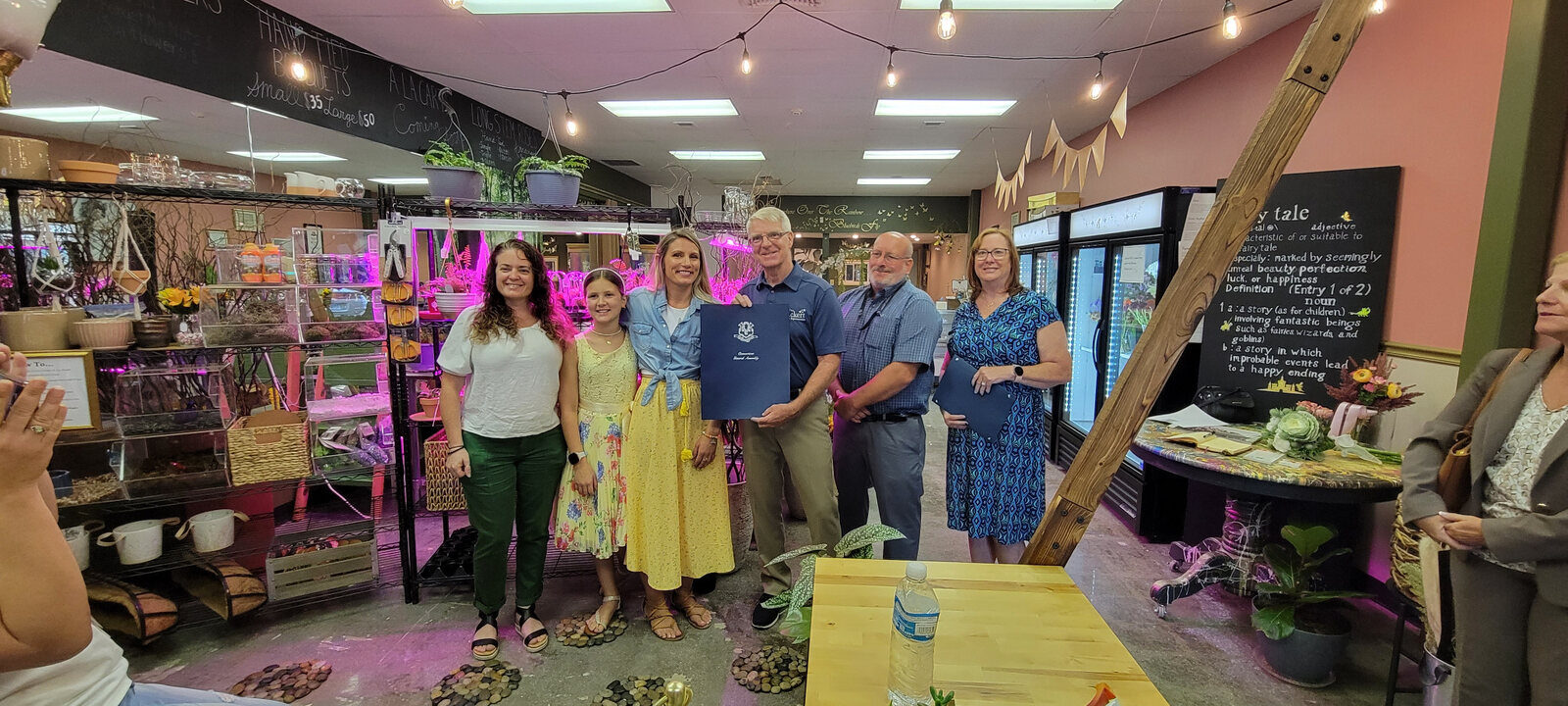 Members celebrating a local business