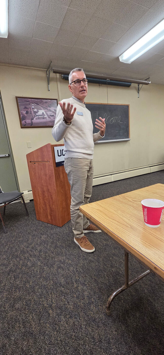 A member presenting at a Chamber Rise & Shine gathering